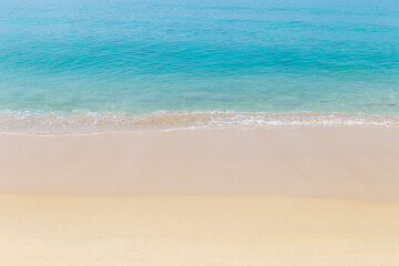 Fototapeta na wymiar Fine sandy beach with clear blue sea water background, tropical island, outdoor day light