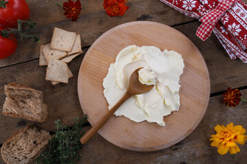 Butter board food trend, butter spread on wooden board ready for toppings
