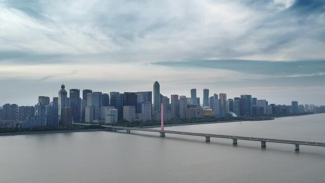 aerial view of suspension bridge over qiantang river in hangzhou in blue sky