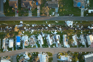 Hurricane Ian destroyed homes in Florida residential area. Natural disaster and its consequences