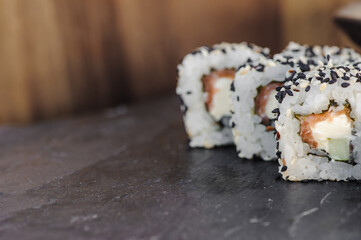 Japanese sushi roll philadelphia on black stone