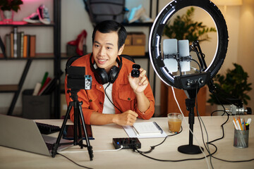 Asian Blogger Making Review Of Earphones