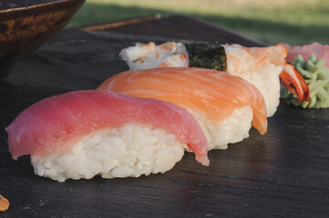 Japanese sushi on black stone outdoor