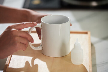 Woman drinking medicine in cup