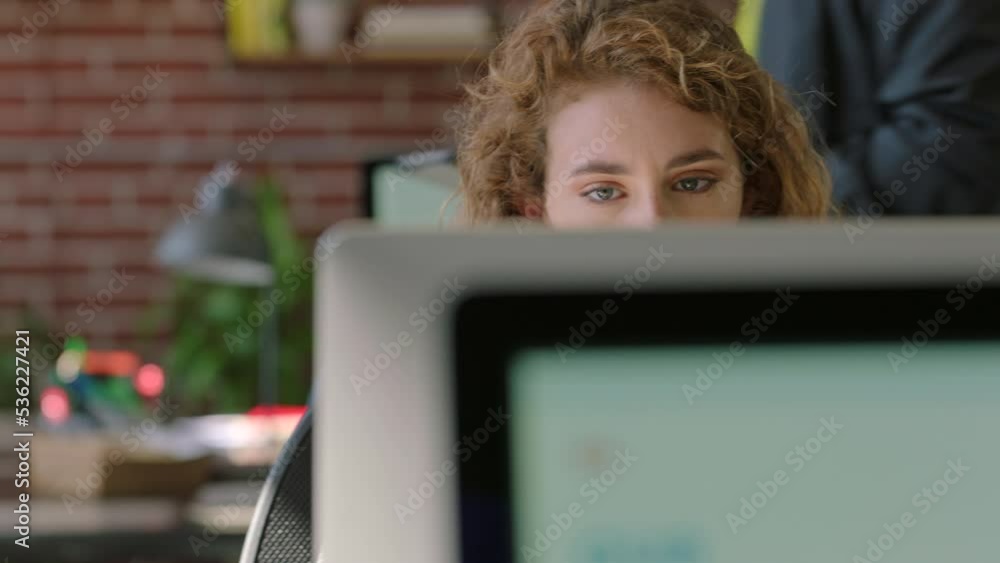 Poster woman on a computer working for a startup social media marketing company doing research of web or in