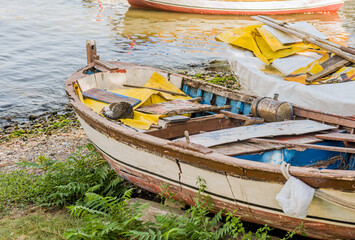 Derelict wood boat in dry dock at harbor in Istanbul.