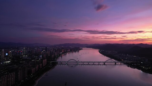 aerial view of qiantang river and modern cityscape of hangzhou at sunset