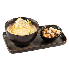 Portion of cheese soup with croutons
