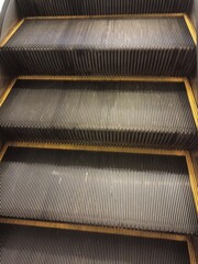 a photo of the escalator stairs in a mall