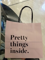 a photo of a product bag that says "pretty things inside"