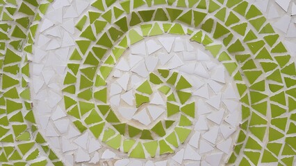 Patterns made by placing broken colored tiles in a row.