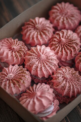 A set of meringue cake in a craft box. Dessert Background.Merengue