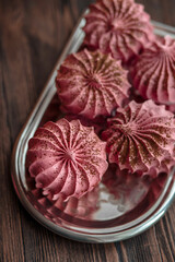 Blackcurrant meringue cake  on a silver tray. Dessert Background. Merengue.