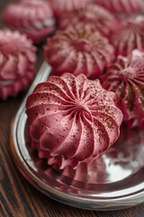 Blackcurrant meringue cake  on a silver tray. Dessert Background. Merengue.