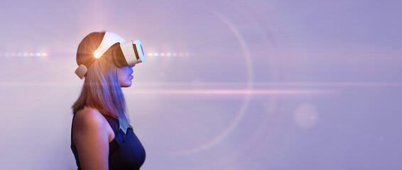 Woman is using virtual reality headset. Concept of virtual, augmented and extended reality and...