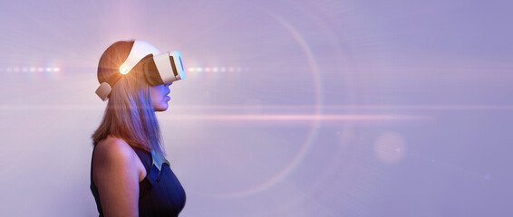 Woman is using virtual reality headset. Concept of virtual, augmented and extended reality and metaverse.