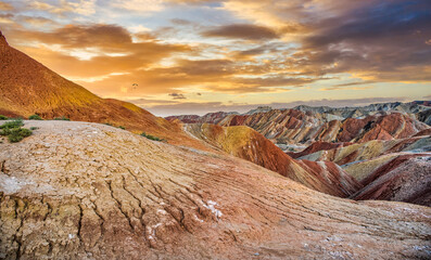 Peaceful sunset light over the colorful Dangxia Landforms close to the Qilian Mountains and the Gobi Desert. Gansu Province. China