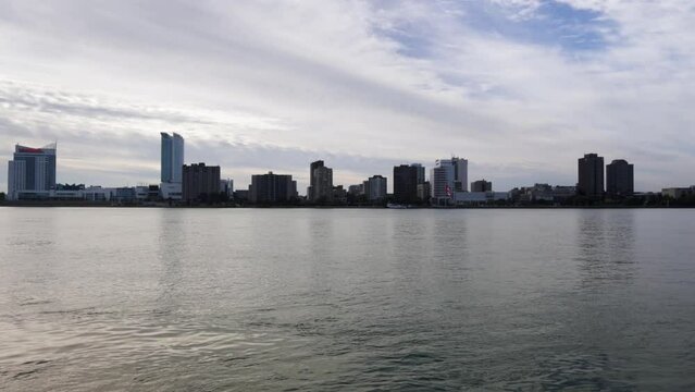 Windsor, Ontario skyline in Canada along the Detroit River with stable video.