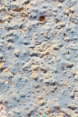 rough blue and white painted plaster wall in mediterranean style