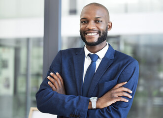Fototapeta premium Leadership, management and arms crossed with businessman in office for executive, success and vision. Smile, innovation and goals with professional black man employee working in corporate company