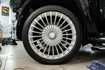 Close up view of a wheel of luxury car.