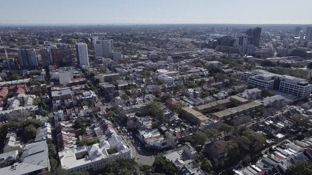 City Buildings Around Redfern Park And World War I Memorial In Redfern, New South Wales, Australia. aerial pullback