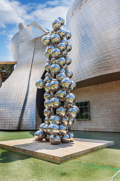BILBAO, SPAIN - JUNE 14, 2014: Sculpture "The Big Three" consisting of 80 stainless steel balls with reflections by Anish Kapoor in front of The Guggenheim Museum in Bilbao.