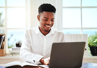 Laptop, typing and schedule with a black man graphic designer working online with his computer and notebook. Email, creative and internet with a young male employee at work on a creative project