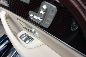 Obraz na płótnie Canvas Front handle door panel with buttons of a luxury car