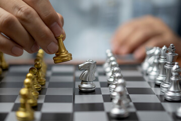 Businessman play on chess board game for ideas and competition and strategy success, business...