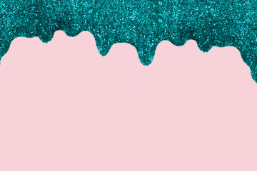 Shiny Turquoise border made of glitter gel on a pink background. Christmas background with copy space