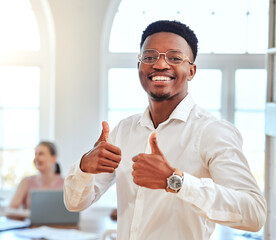 Plakat Thumbs up, hands and portrait of an african businessman standing in a modern office during a meeting. Happy, smile and black employee with an approval, agreement and yes gesture in the workplace.