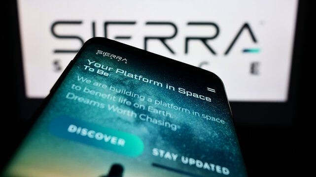 Stuttgart, Germany - 09-30-2022: Mobile phone with website of American aerospace company Sierra Space Corporation on screen in front of logo. Focus on top-left of phone display.