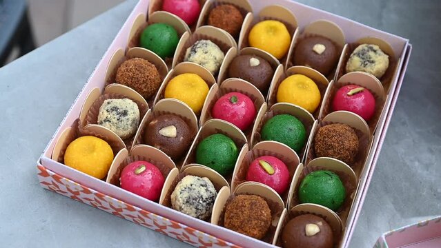 Colourful Diwali sweets pack, Indian sweet festival dish called mithai, Asian sweets, Vegan sweets