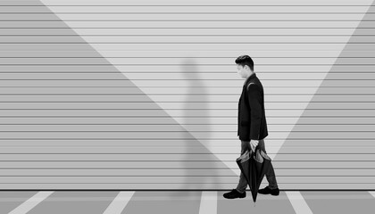 Wide angle shot of a man walking down the street, minimalistic shot, a man walking in his imaginary world, artistic designs on the wall, high-quality image. Black and white image.;