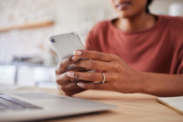 Woman, hands and phone for business startup working on table chatting, texting or social media at home. Hand of a freelancer in remote work and browsing mobile smartphone in communication by desk