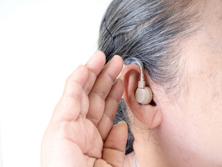 Elderly woman wearing a hearing aid