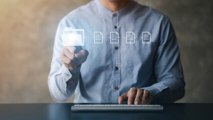 business man with holograms of digital document files, data files on computers stored as cloud...