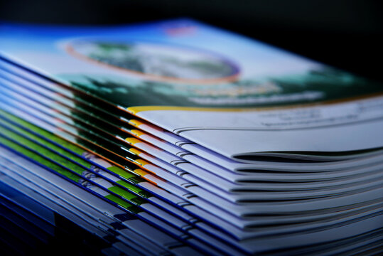 pile of annual report books on black background