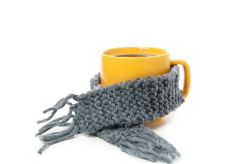 Cup of coffee with scarf isolated on white background