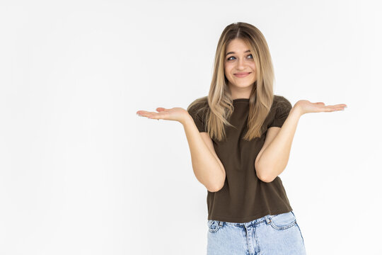 Photo Of Happy Cheerful Woman Hold Hands In Balance Compare Products Isolated On Grey Color Background