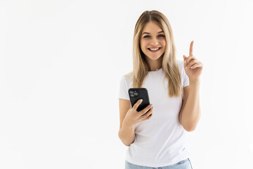 Photo of young cheerful woman happy positive smile have an idea genius use cellphone over white...