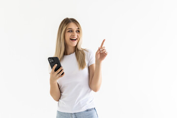 Photo of young cheerful woman happy positive smile have an idea genius use cellphone over white...