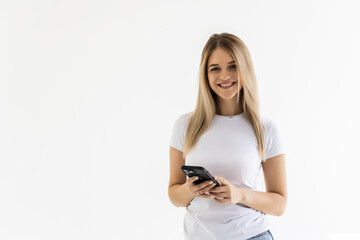 Portrait of happy woman using mobile phone, holding smarphone chatting with friends while sitting at home, scroll internet feed, use application, smile at display