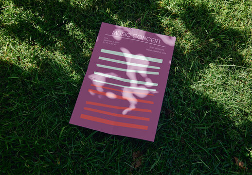Vertical A2 Poster Mockup Over Green Grass With Sunlight Shadows