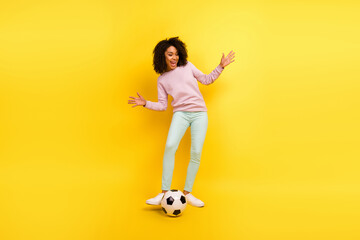 Full length photo of young excited girl good mood play footbal gamer isolated over yellow color...