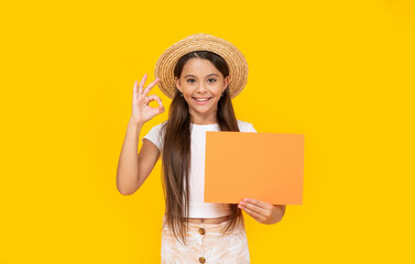 happy teen kid with copy space on orange paper on yellow background