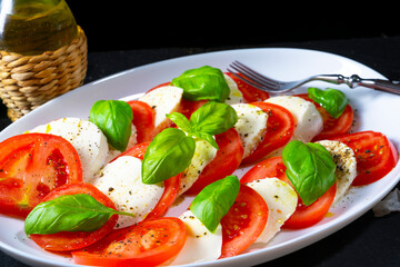 Tomato with mozzarella and basil