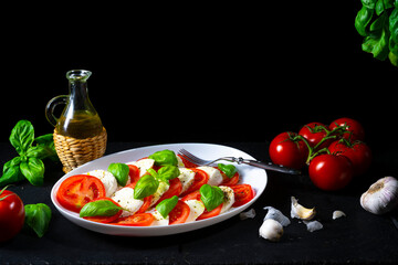 Tomato with mozzarella and basil
