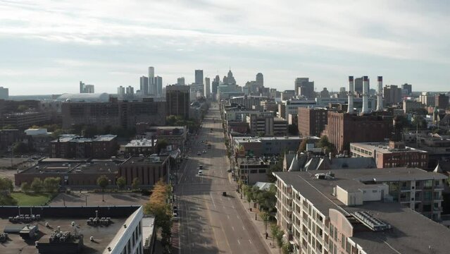 Detroit, Michigan skyline wide shot with drone video moving up showing Woodward Avenue.